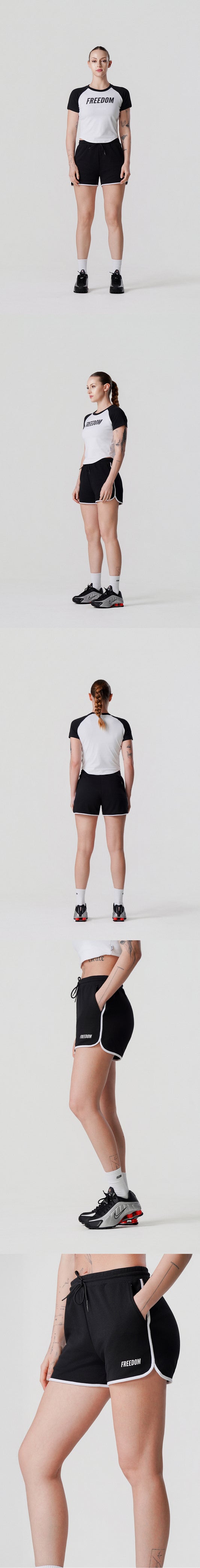 กางเกงขาสั้นผู้หญิง Dolphin Shorts แต่งโลโก้ (สีดำ)