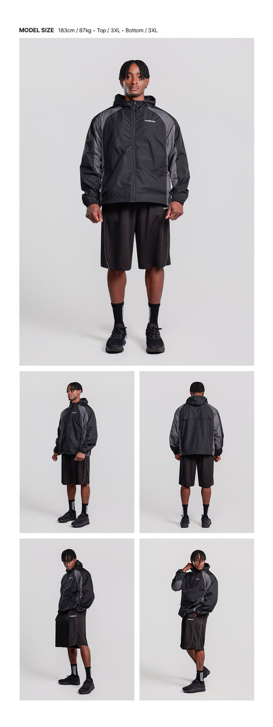Split Light Windbreaker (Black) — model wearing the outfit